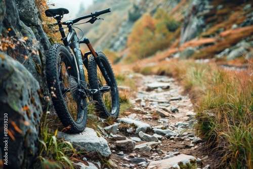 Mountain bike on the side of rocky road trail.