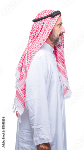 Senior arab man wearing keffiyeh over isolated background looking to side, relax profile pose with natural face with confident smile.