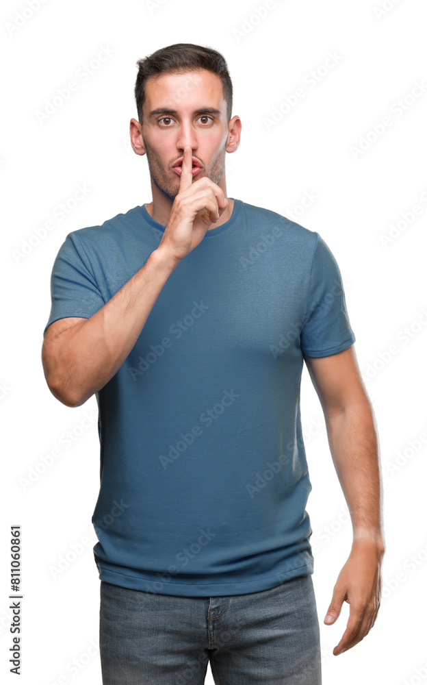 Handsome young casual man asking to be quiet with finger on lips. Silence and secret concept. Handsome young casual man asking to be quiet with finger on lips. Silence and secret concept.