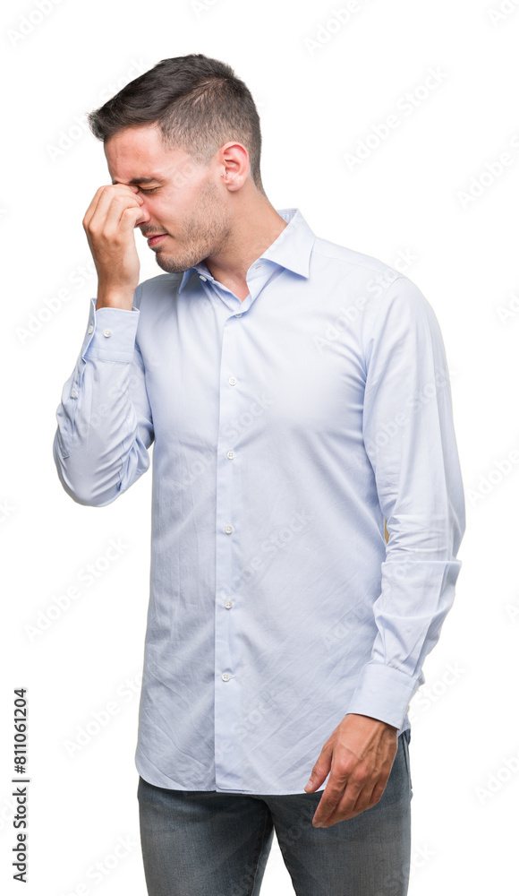 Handsome young businessman tired rubbing nose and eyes feeling fatigue and headache. Stress and frustration concept. Handsome young businessman tired rubbing nose and eyes feeling fatigue and headache. Stress and frustration concept.