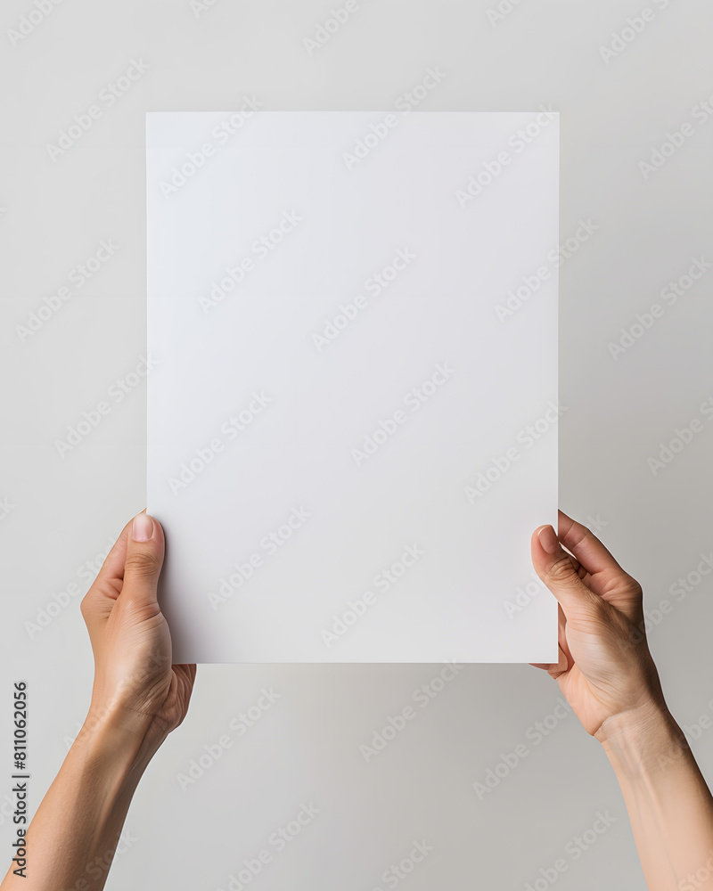 Hands holding blank paper mock up isolated on white background Hands holding blank paper mock up isolated on white background