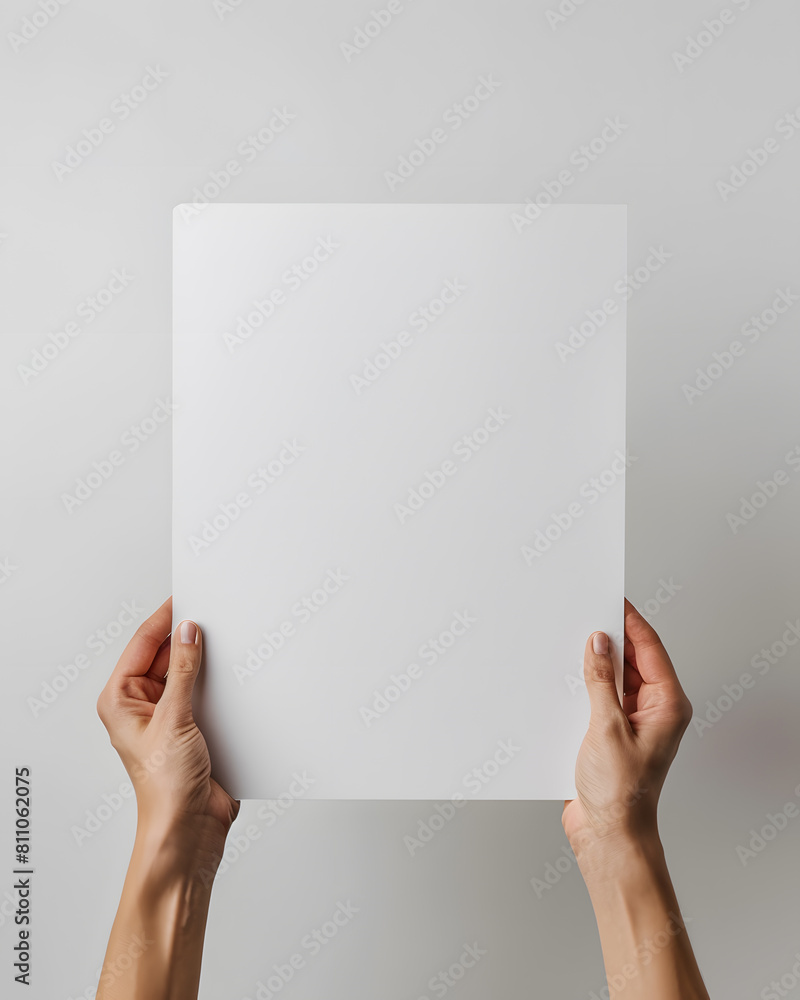 Hands holding blank paper mock up isolated on white background Hands holding blank paper mock up isolated on white background