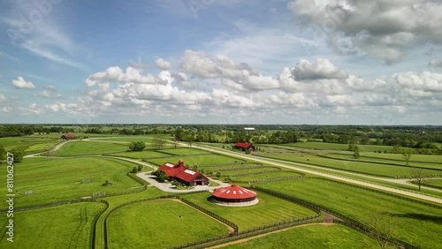 Soaring over the pastures and red-roofed barns of horse farms in Kentucky's Bluegrass region photo