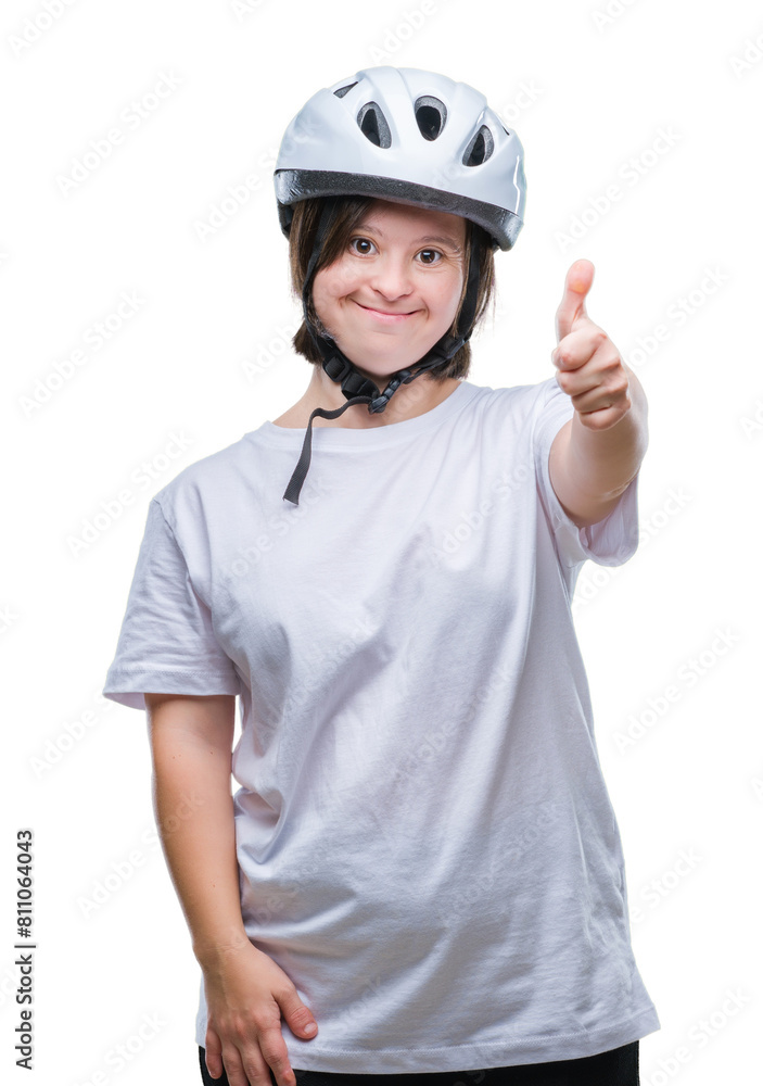 Young adult cyclist woman with down syndrome wearing safety helmet over isolated background doing happy thumbs up gesture with hand. Approving expression looking at the camera with showing success. Young adult cyclist woman with down syndrome wearing safety helmet over isolated background doing happy thumbs up gesture with hand. Approving expression looking at the camera with showing success.