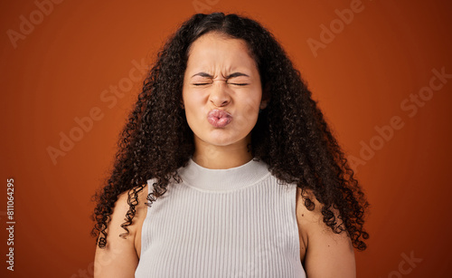 Canvas Print Woman, pouting lips and studio with eyes closed, emoji and expression on red background in funny face