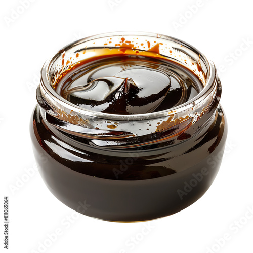 Organic and natural molasses in a glass jar. photo