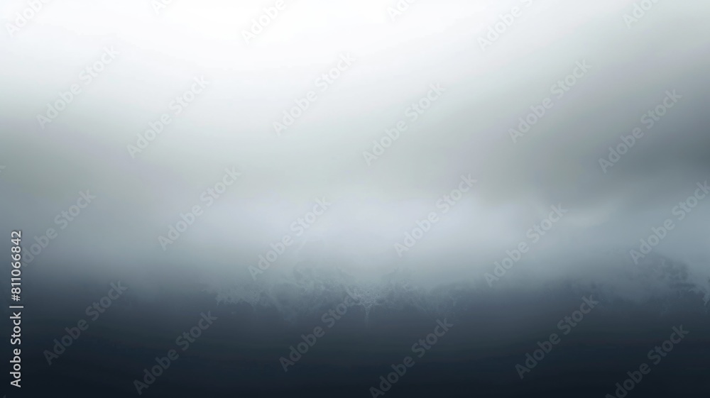 serene view of misty mountain peaks shrouded in layers of fog and clouds, creating a tranquil and atmospheric landscape