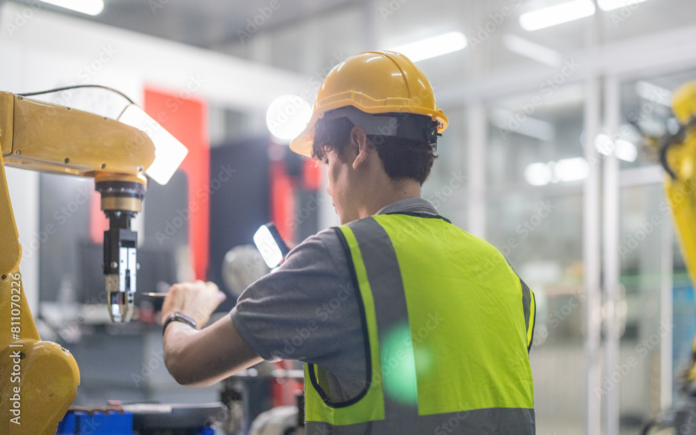 Trainees master robotics with hands-on workshops and quality control in manufacturing academy. Trainees master robotics with hands-on workshops and quality control in manufacturing academy.
