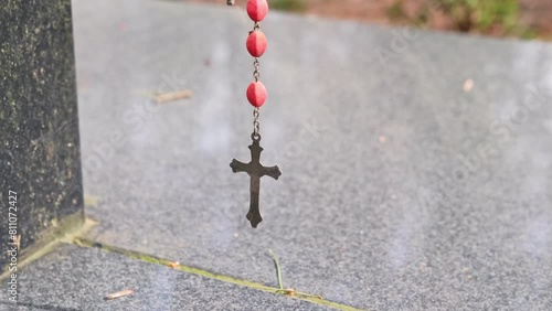 Prayer Rosary Hanged by Pilgrims at Christian Worship Place as Votive Offering photo