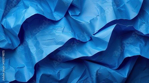  A detailed image of blue fabric with intricate crinkles and folds photo