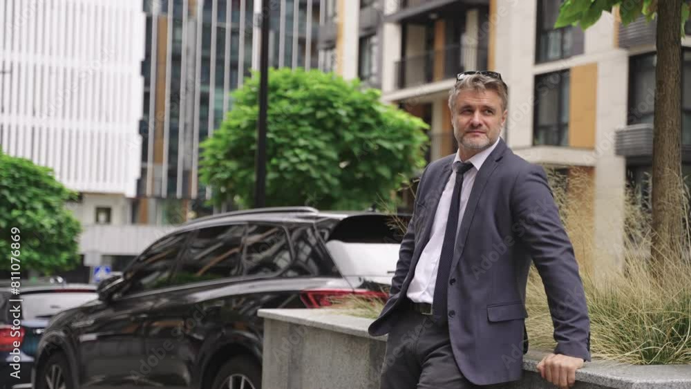 Adult man in suit resting outdoors in the city. Real time concept Adult man in suit resting outdoors in the city. Real time concept