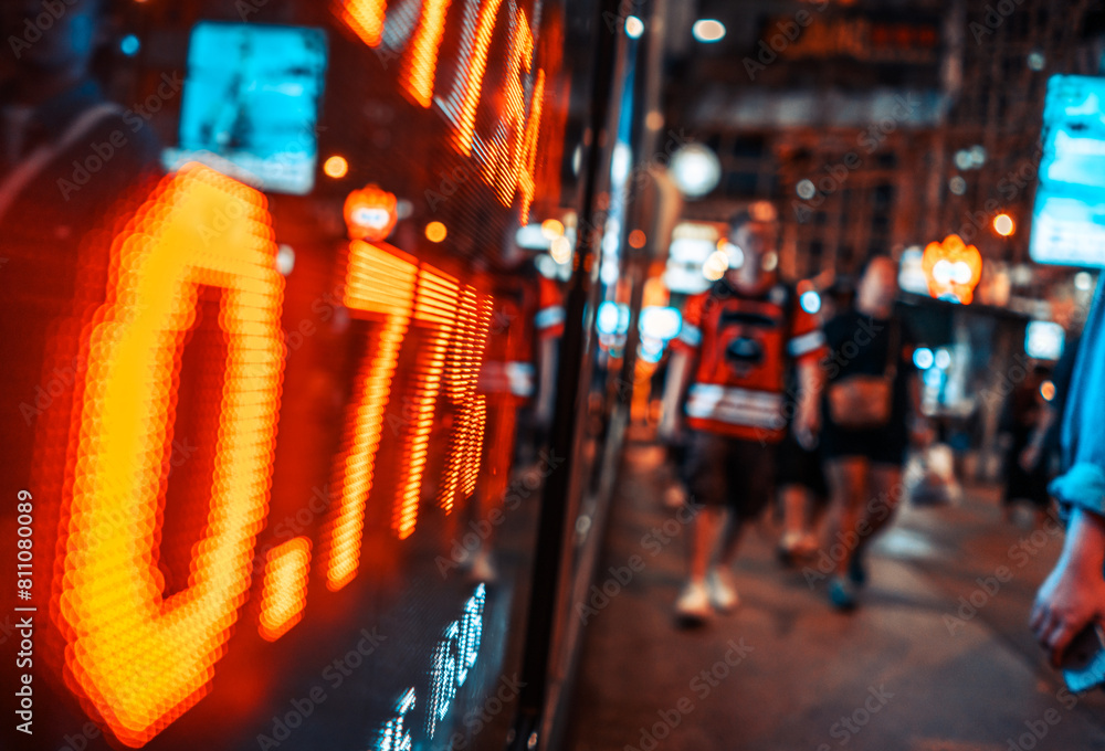 Vibrant City Life at Night with Blurry Pedestrians and Neon Lights Vibrant City Life at Night with Blurry Pedestrians and Neon Lights