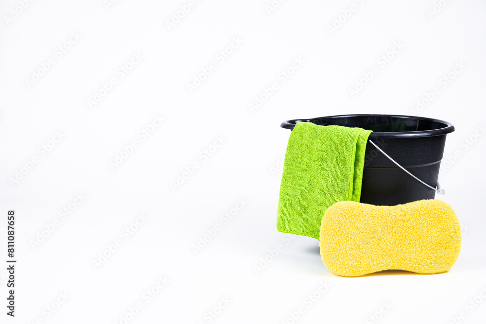 Black cleaning bucket with sponge and wash rag. Black cleaning bucket with sponge and wash rag.