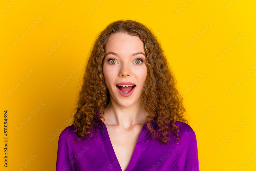 Photo portrait of attractive young woman amazed excited face dressed stylish violet clothes isolated on yellow color background Photo portrait of attractive young woman amazed excited face dressed stylish violet clothes isolated on yellow color background