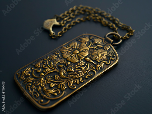A brass tag with floral design on it. © VISUAL BACKGROUND
