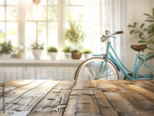 Empty wooden table against blurred living room backdrop  with blue bicycle near window. Versatile mockup for displaying product with customizable layout. Let your creativity shine in this setting.