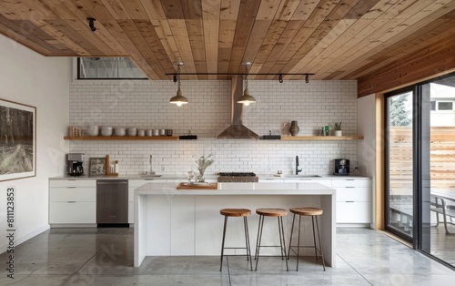 white kitchen with wooden ceiling, white wall tiles and concrete floor. Kitchen island in the center of room
