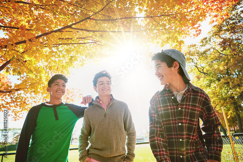 Fotografie Happy, boys or friends in park together for fall holiday, break or trust and support