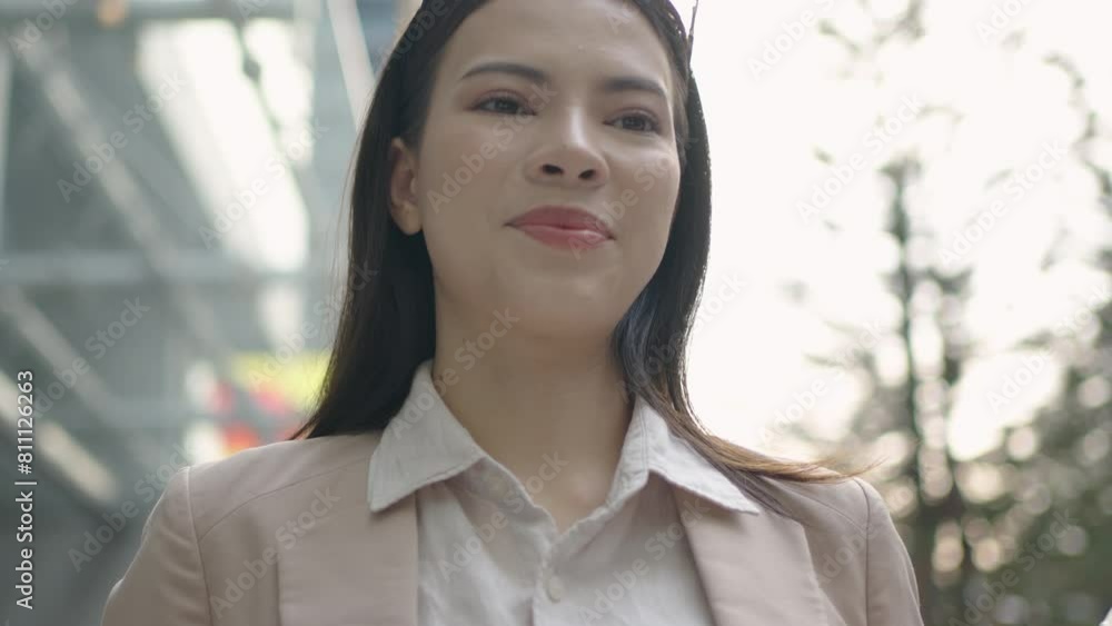 White businesswoman holding a mug of hot coffee walks in the city after work. White businesswoman holding a mug of hot coffee walks in the city after work.