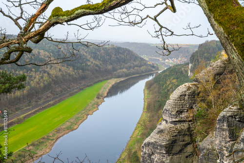 Overlooking the serpentine Elbe River as it carves through Saxon Switzerland National Park from the Bastei cliffs during springtime. Germany