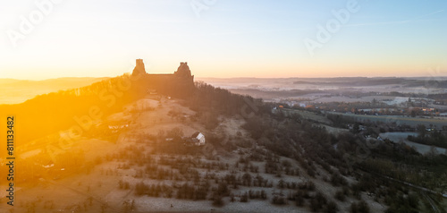 Trosky medieval castle ruins at cold morning sunrise time. Bohemian Paradise, Czech: Cesky raj, Czechia. Aerial view from above.