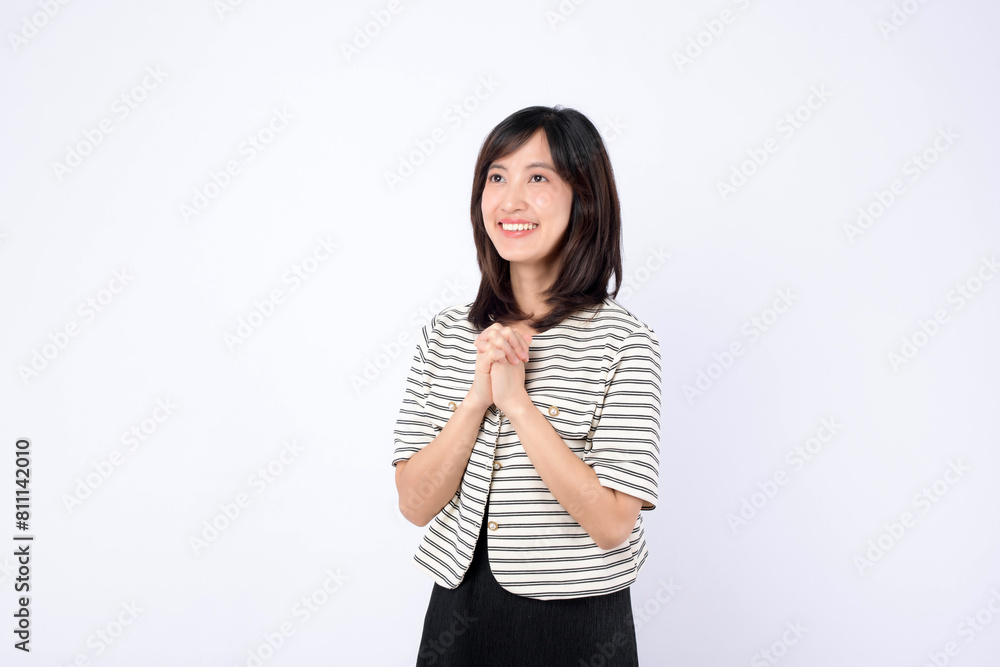 Asian woman is expressing delight against a white background. Asian woman is expressing delight against a white background.