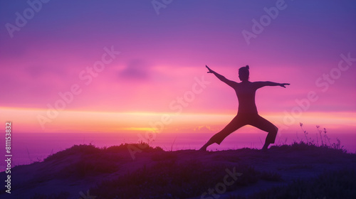 Wallpaper Mural An inspiring silhouette of a person performing the warrior pose (Virabhadrasana) on a hilltop, with the first light of dawn illuminating the horizon behind them. Dynamic and dramat Torontodigital.ca
