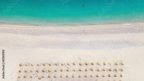 Kefalonia island 4K lonely beach aerial video. Flying over sun umbrellas and sunbeds Myrtos Beach unique turquoise water seashore with white pebbles often proclaimed as one of best beaches in Greece photo