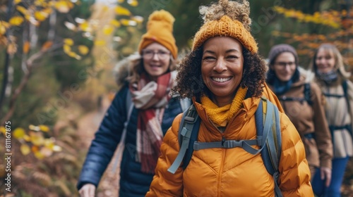Women In Fall. Multiracial Friends Enjoying Fun Trekking Day in Mountain Forest photo