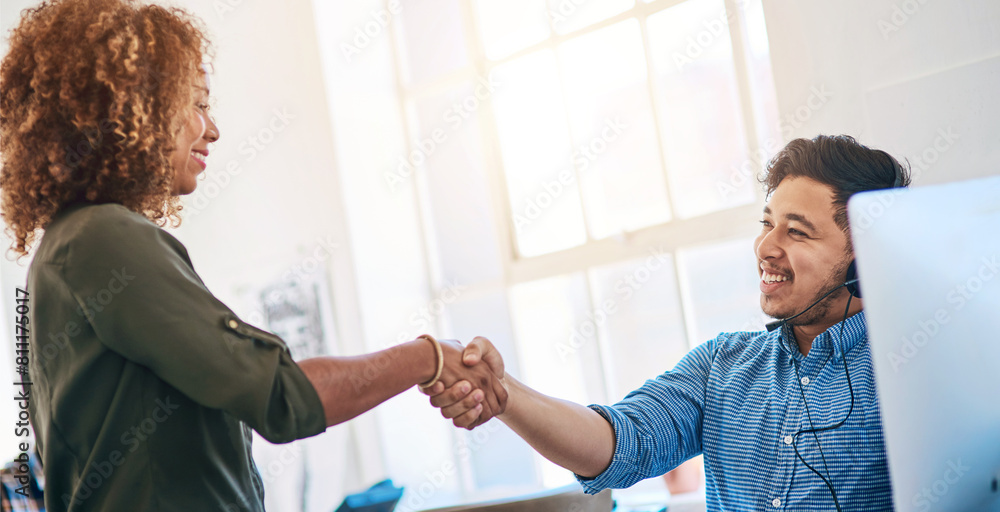 Fototapeta premium Business people, man and woman with handshake, call center and telemarketing with promotion. Modern office, coworkers and employees shaking hands, computer and agreement with support and thank you