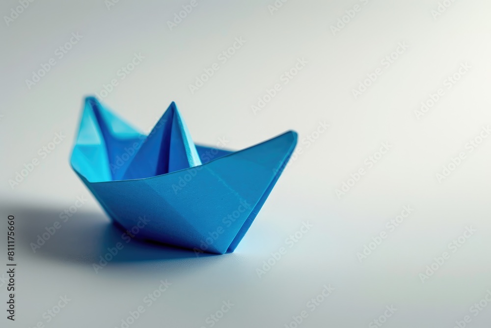 Ocean Dreams: Closeup of a Blue Paper Boat Ocean Dreams: Closeup of a Blue Paper Boat