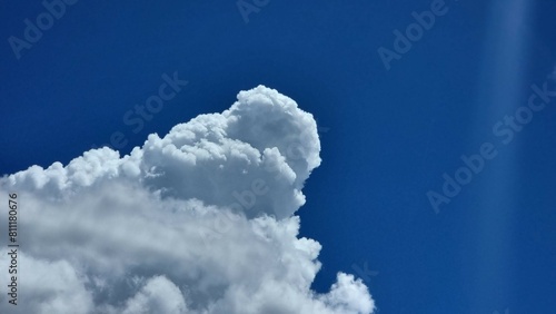 blue background. Blue bright sky with cotton clouds