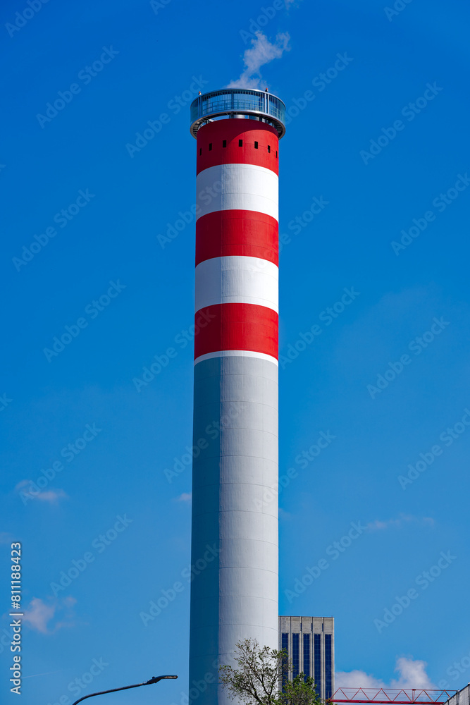 Looking up concrete red and white striped concrete chimney of district heating at Swiss City of Zürich on a sunny spring noon. Photo taken May 10th, 2024, Zurich, Switzerland. Looking up concrete red and white striped concrete chimney of district heating at Swiss City of Zürich on a sunny spring noon. Photo taken May 10th, 2024, Zurich, Switzerland.