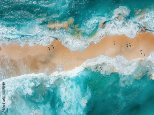 Aerial view of the beach with waves and people  top down view of the sandy shore with transparent water