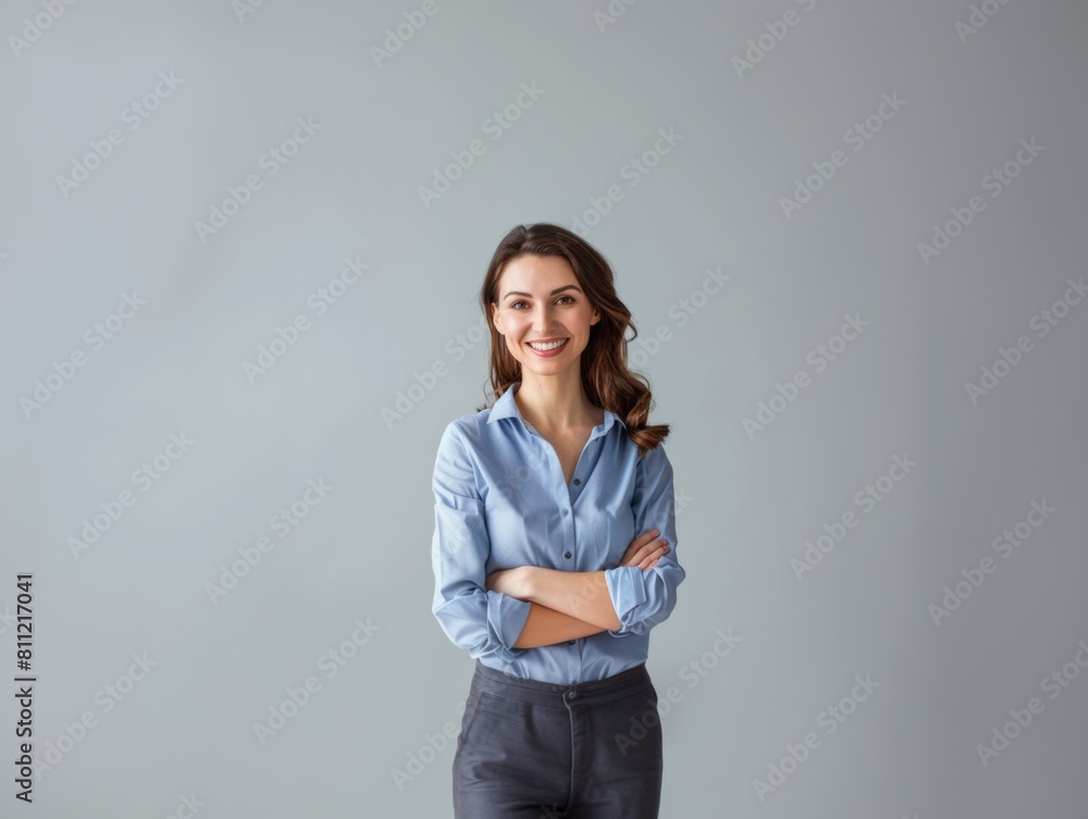 Multiethnic woman in blue clothes smiling on a white background.Company employee, worker, businesswoman. Multiethnic woman in blue clothes smiling on a white background.Company employee, worker, businesswoman.