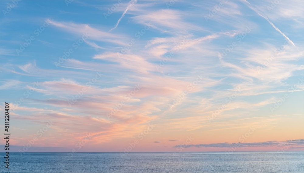 Obraz premium Sailing into Twilight: Pink Cirrus Clouds Above a Blue Canvas