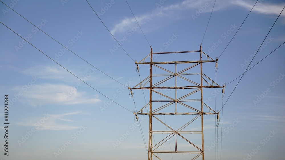 high tension electric tower against the sky