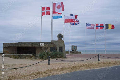 Bernieres-sur-Mer, France - May 1, 2024: Juno Beach D-Day Landing Memorial. Cassine bunker. Queen's Own Rifles of Canada memorial. Cloudy spring day. Selective focus.