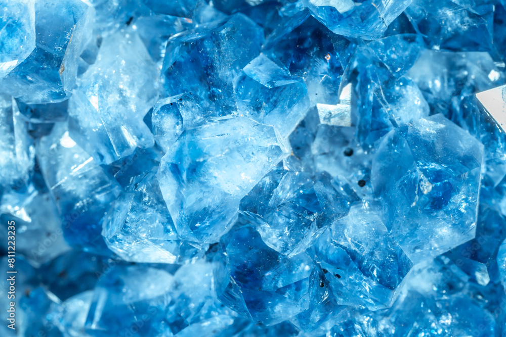 Blue Crystal Mineral Stone. Gems. Mineral crystals in the natural environment. Texture of precious and semiprecious stones. Seamless background with copy space colored shiny surface of precious stones Blue Crystal Mineral Stone. Gems. Mineral crystals in the natural environment. Texture of precious and semiprecious stones. Seamless background with copy space colored shiny surface of precious stones