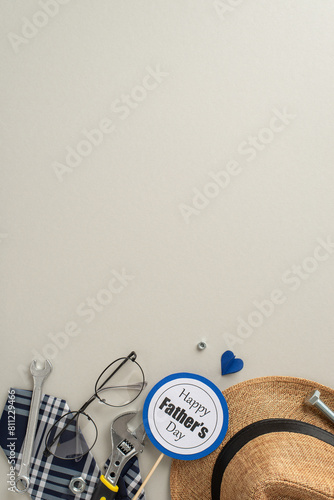 A creative vertical Father's Day themed image featuring various tools, eyeglasses, a straw hat, and a Happy Father's Day sign, set against a neutral gray backdrop