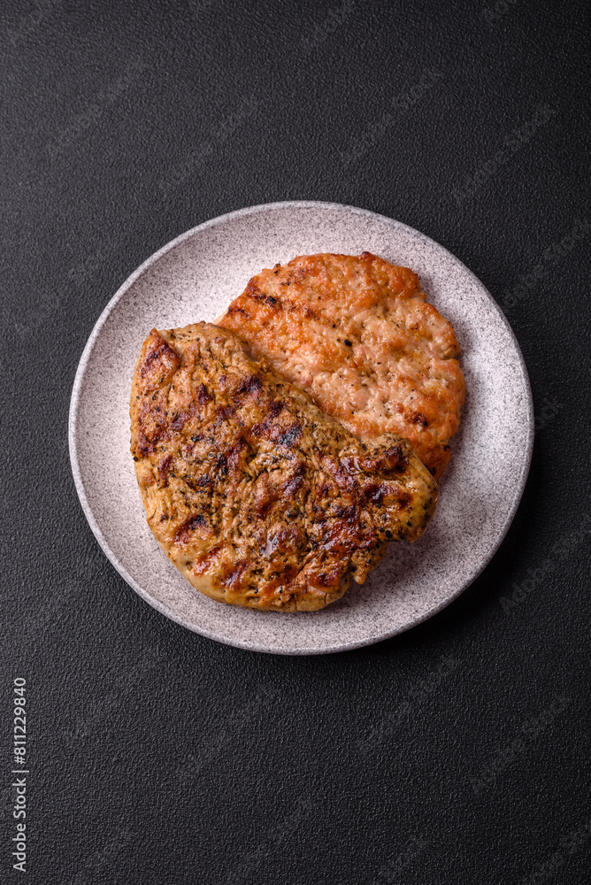 Delicious juicy pork steak with salt, spices and herbs Delicious juicy pork steak with salt, spices and herbs