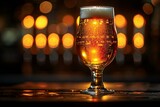 Glass of beer on a bar counter in a pub with bokeh background