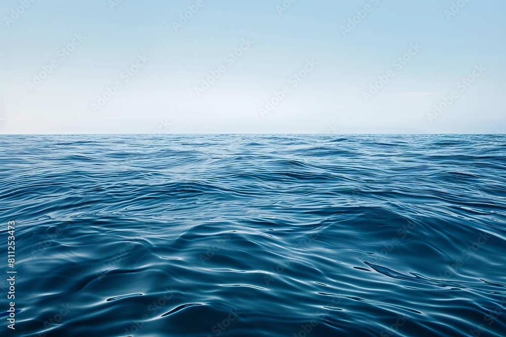 Obraz premium A minimalist ocean background, featuring a calm sea surface with subtle wave textures, offering a clean and uncluttered space for copy