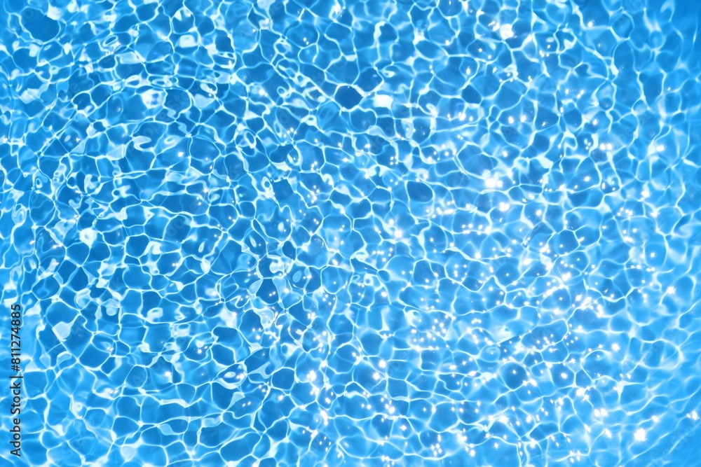 Obraz premium Blue water ripple background in swimming pool