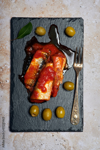 Sardines with tomato and olives