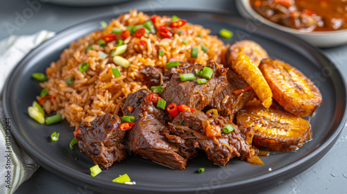 Delicious ghanaian jollof rice platter served with spicy beef, fried plantains, and fresh chili and scallions garnish