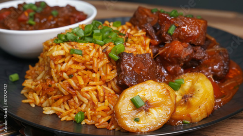 Traditional ghanaian jollof rice with tender beef stew and fried plantains, topped with fresh green onions on a dark serving dish