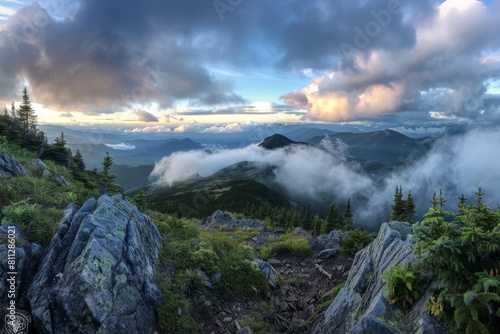 Panoramic view of mountains and clouds from the top of a mountain, A panoramic view from a mountaintop with clouds rolling in over the horizon © Iftikhar alam