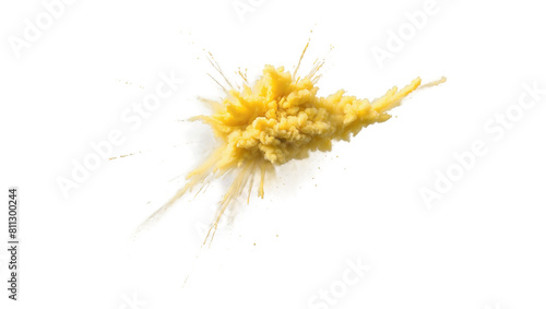 Vivid yellow powder explosion on a white background