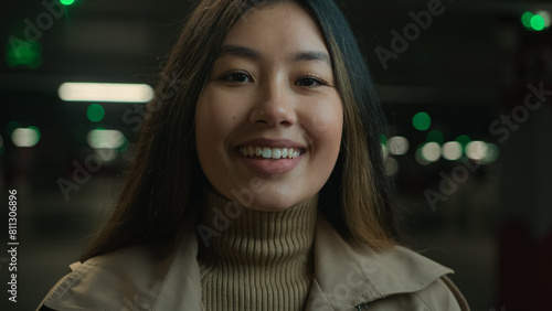 Close up portrait smiling happy woman Asian chinese korean girl ethnic japanese student businesswoman driver lady stand in car parking satisfied dental toothy smile looking at camera female head shot photo